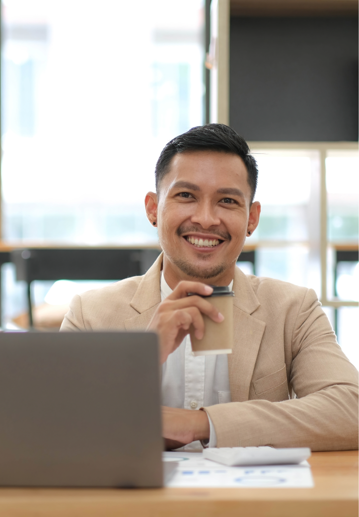 Business Man, possibly remitter, very happy, behind computer